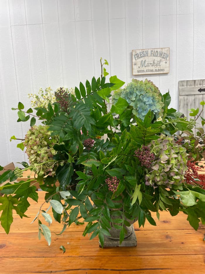 Endless Summer hydrangeas and bits of Japanese maple add subtle contrast to your display, allowing your dahlias to take center stage.
