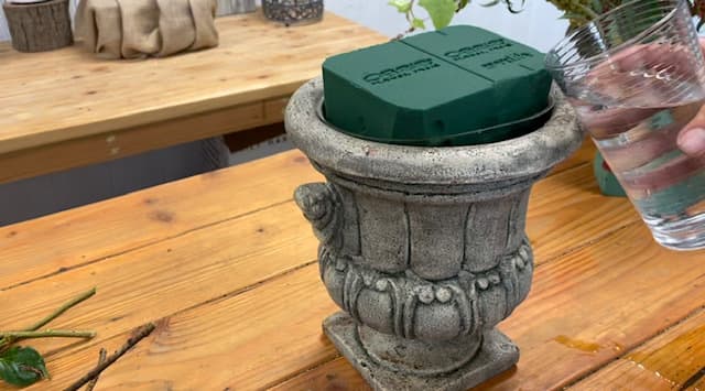The first step to creating an abundant display of dahlias is prepping your vase with floral foam.