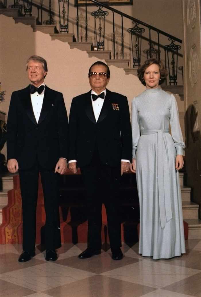 Jimmy Carter, Josip Tito and Rosalynn Carter pose for a formal portrait during a state dinner