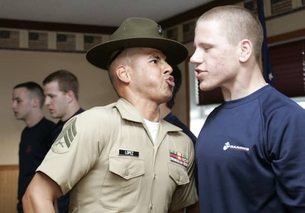 "What part of stand here and don't blink...Did you not understand?" A Marine recruit gets a taste of boot camp in this photo taken in Cedar Falls, Iowa (WCF Courier.com)