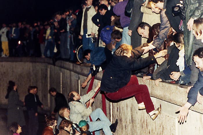 1989. Eventually Communist repression of Eastern Europe had to end. West Berliners help East Berliners escape over the Berlin Wall -symbol of the divide between freedom and dictatorship - on 10th November 1989