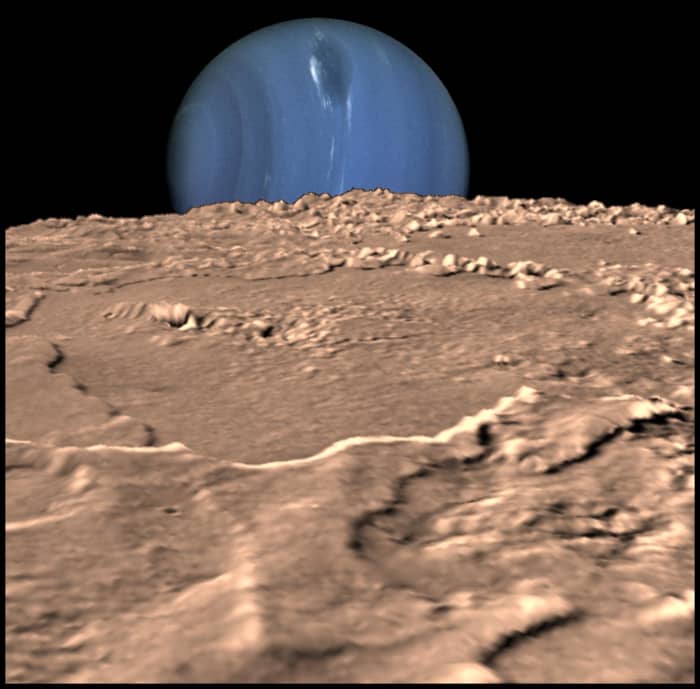 Voyager's image of Triton, with the ominous blue globe of Neptune behind it - the planet which will eventually seal it's fate, as Triton's orbit decays