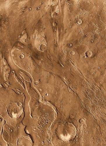 Further evidence of Mars's watery past. The relic of an ancient dried-up water flood plain can be seen amidst the Martian craters.