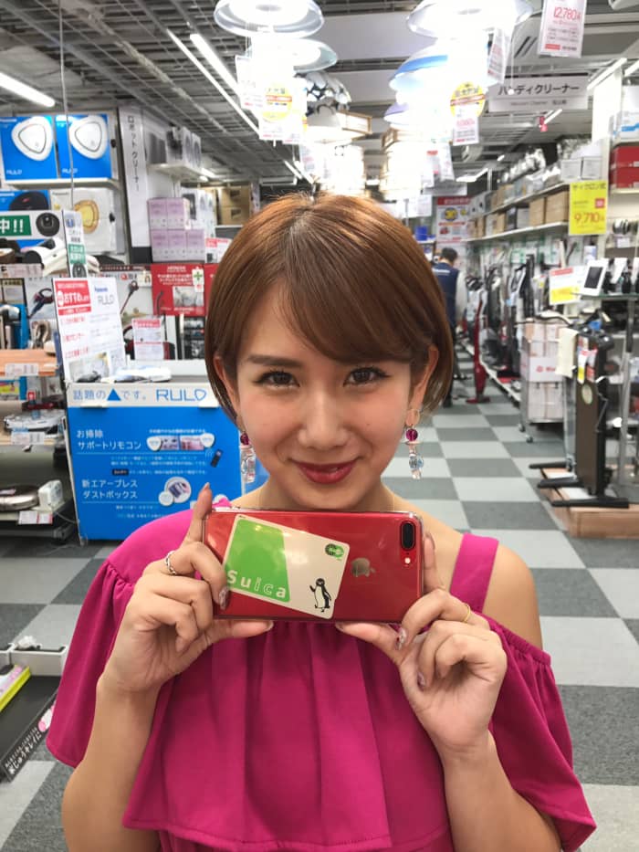 Chisato Okai one of the cutest members of the group was born in 1994. It looks like she is about to take a photo.