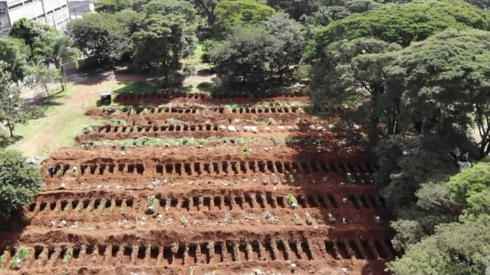 This photo shows one of the many Corona-virus mass grave in Brazil. There have been so many deaths that they are digging graves everywhere, I believe that they have even buried their deaths on the beach.