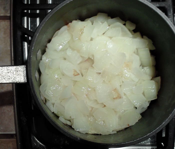 Onions wilting in a pot. This is actually a soup pot of lots of onions for making French onion soup. I usually do the ones for split pea soup in the microwave.
