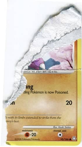 A legitimate Pokémon card with a thin black ink layer, separating two distinct layers of material that make up the front and back of the card.