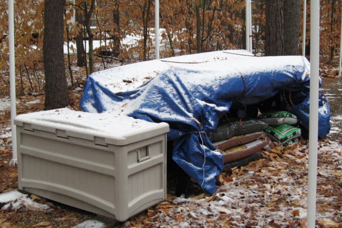 Be sure to anchor the tarp with ropes or heavy stones to keep it from being blown off.