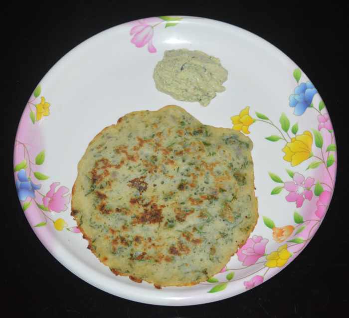 When the edges become golden brown, flip it. Add some oil or ghee to the top. Allow the bottom side also cook nicely and get golden brown spots. Remove and place it on a plate. Serve hot with coconut chutney. Enjoy!