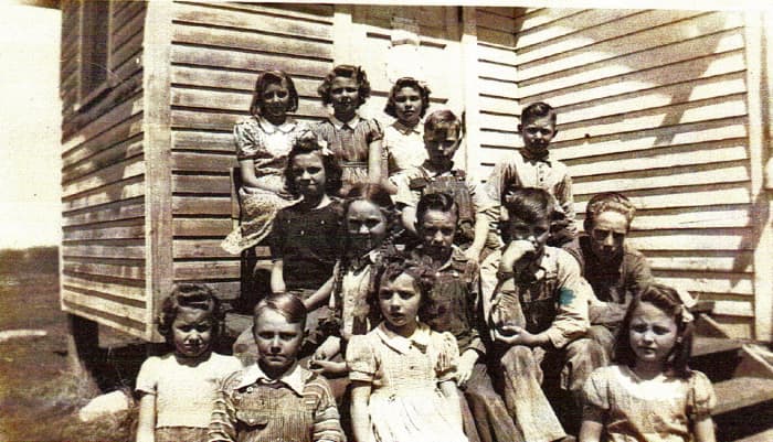 My cousin, Carolyn Stafford is in this group who attended Prairie Belle shortly before it closed down. The older boy by the steps is Howard Martin, Clyde's brother.