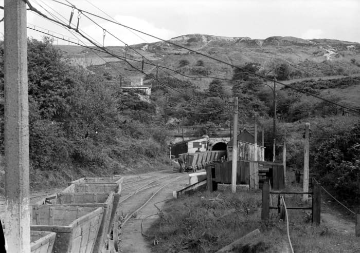 .. Viewed uphill, Trustee Drift adit ahead and escarpment above ... How much more is in there? Dorman Long had considered the expense of extraction, weighed up the bills versus importing and opted for the latter. Ninety-nine year lease was up anyway