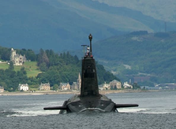 A British Vanguard-class submarine leaving its base on the Clyde. Aboard is the Prime Minister's Letter of Last Resort.