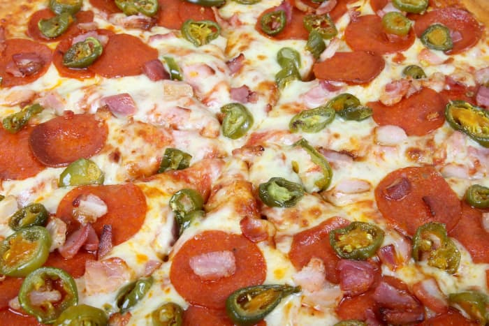 This photo symbolizes what the main character Inspector Gadget is looking at in the beginning of the episode and he is looking at a photo of a pizza with several ingredients.