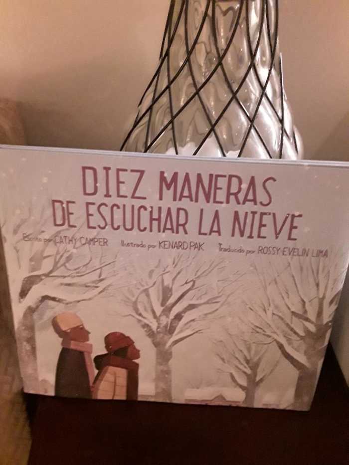 Snowfall and Family Celebration With Text in Spanish in Beautiful