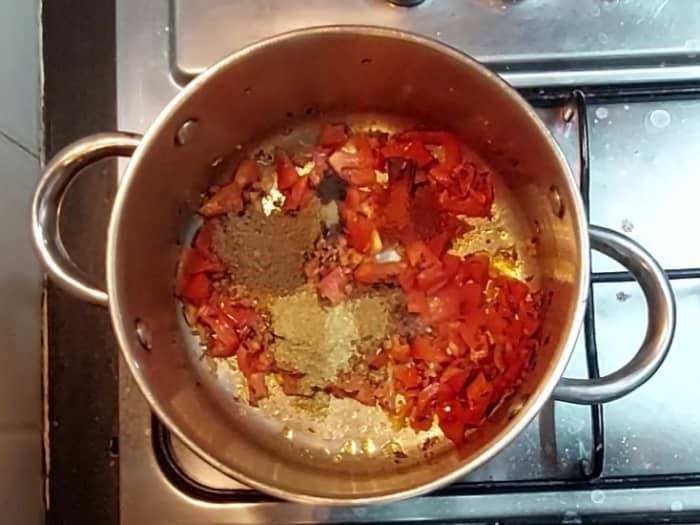 Add 1/2 teaspoon turmeric powder, 1/2 teaspoon cumin powder, 1/4 teaspoon dry mango powder, 1 teaspoon red chili powder, 1 teaspoon coriander powder, 1/2 teaspoon garam masala powder and 1 teaspoon chat masala.