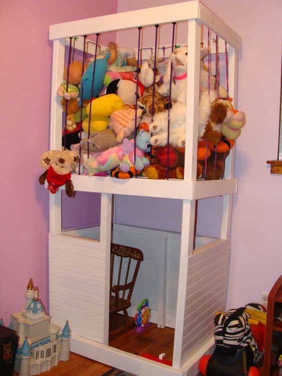 Get those stuffed animals out of the way, plus a place to play! DIY stuffed animal storage and playhouse