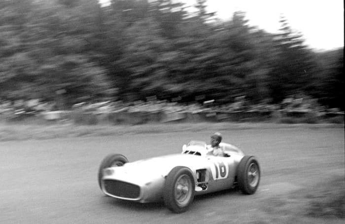 Juan Manual Fangio in the 1954 German Grand Prix. This was in the days before run-off areas and tire barriers with almost no protection for spectators should an errant race car come flying off the track.