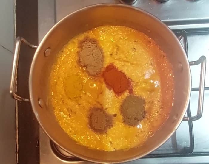 Add 1/2 teaspoon turmeric powder, 1/2 teaspoon cumin powder, 1/2 teaspoon red chili powder, 1 teaspoon coriander powder, 1/2 teaspoon garam masala powder.