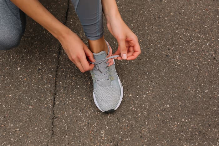 Photo by Hanna Auramenka from Pexels: https://www.pexels.com/photo/person-tying-up-her-shoelace-8497536/