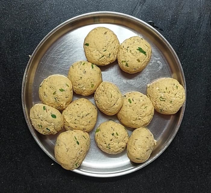 After 10 minutes, roughly knead the dough for 1 minute. Then divide the dough and make equal-sized balls.