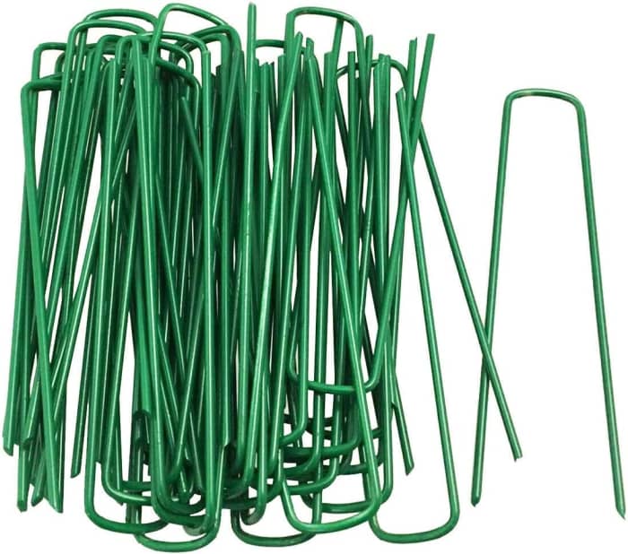Garden staples that aid in simple ground layering. They are available at most nurseries, garden centers and online.