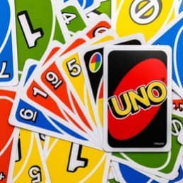 Toward the start of their turn, a player can match either the number or the shade of the face-up card with a card in their grasp.