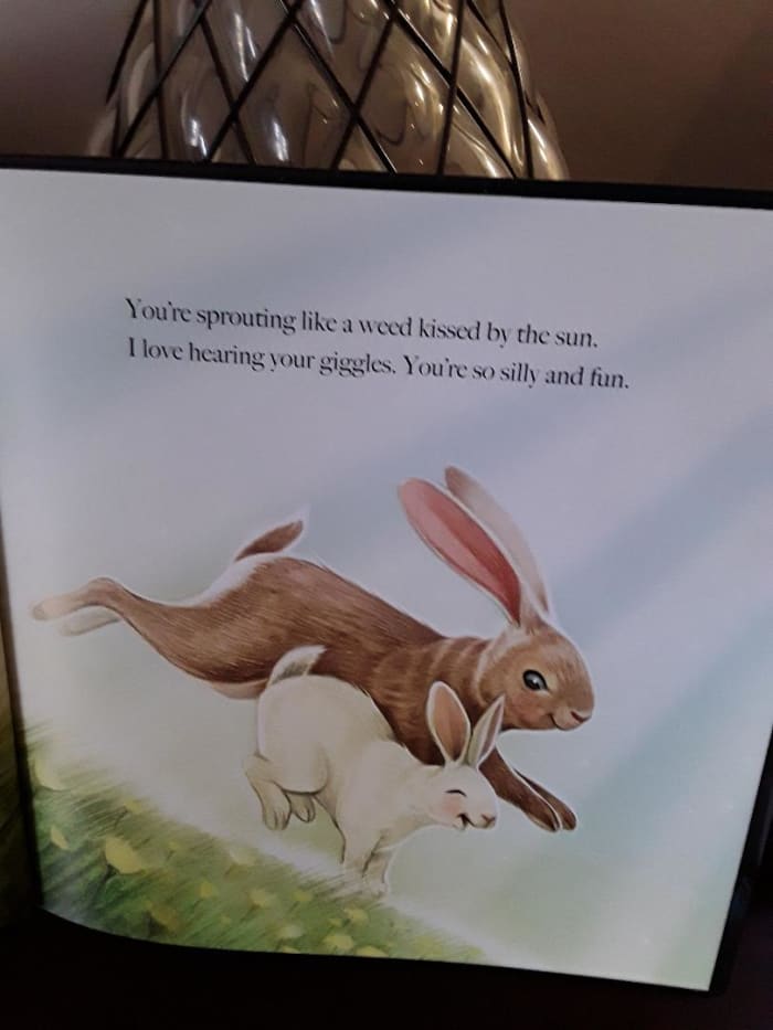 Mama rabbit with baby is proud that her baby is growing