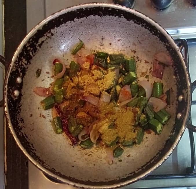 Once ladies finger cooked well, add 1/2 teaspoon red chili powder, 1/2 teaspoon coriander powder, 1/4 teaspoon cumin powder, 1/2 teaspoon garam masala powder.