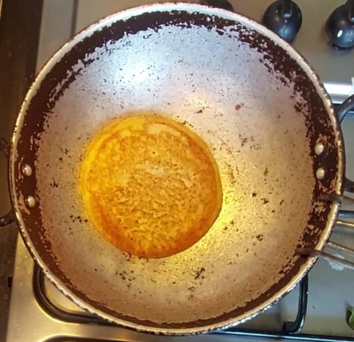 Once done, flip and cook on the other side too. This dosa is crispy outside and soft inside.Once done, transfer to a plate. Repeat the same procedure and make dosas.