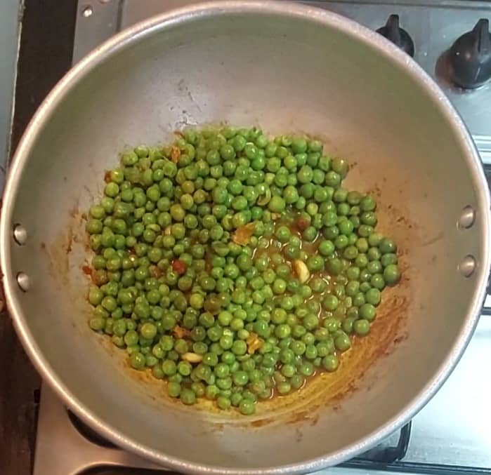 Add 1/2 teaspoon dry mango powder, mix well. Close the lid and cook in medium flame for 3-4 minutes or till water evaporates completely. Once done switch off the flame and let it cool down.
