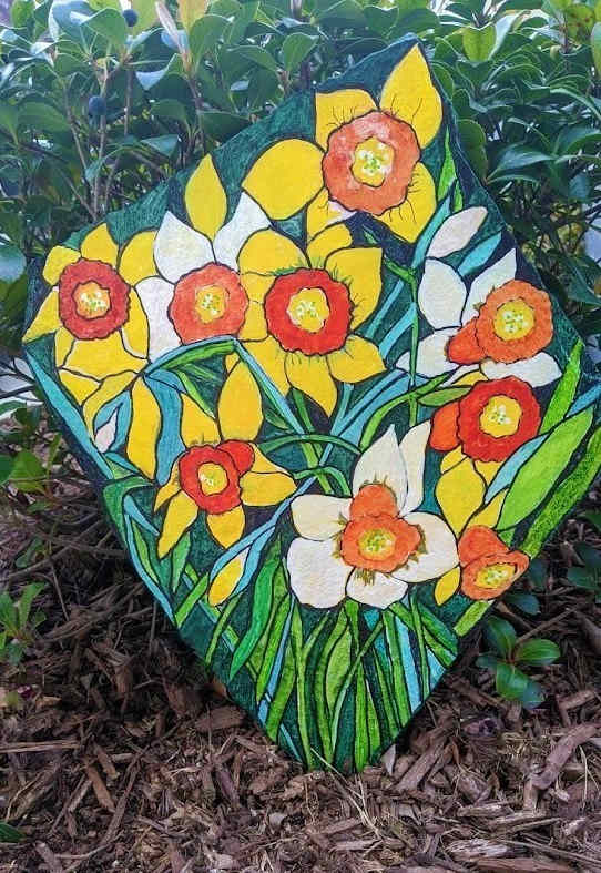 To make the rock pictured above I used a book called "Trace & Paint Flowers" which I purchased at my local Hobby Lobby craft store.