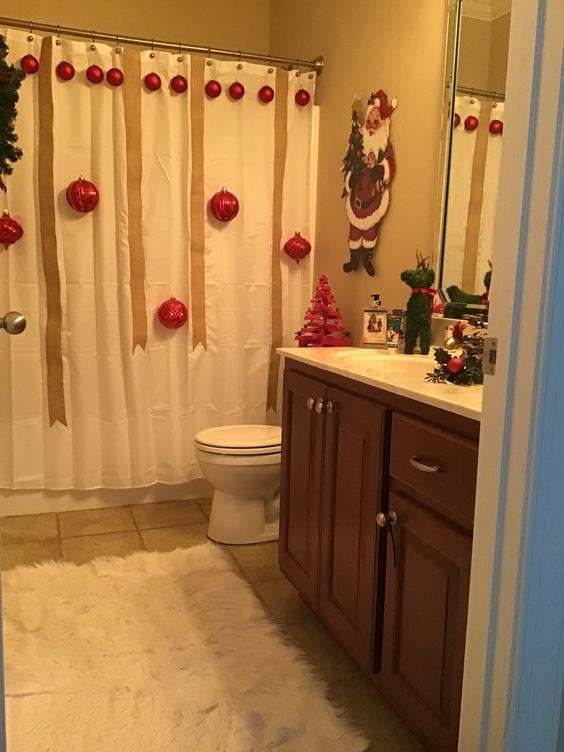Hang ornaments from the shower curtain hooks in the bathroom