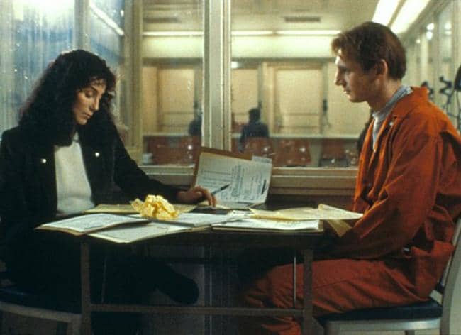 Court appointed attorney Kathleen Riley tries to communicate with deaf suspect Carl Wayne Anderson (Liam Neeson)