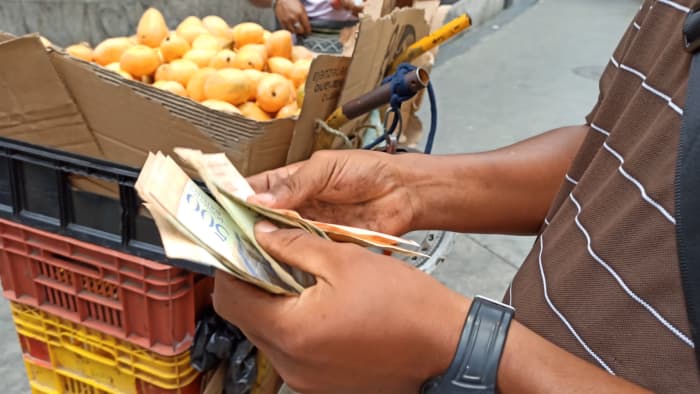 A man, counting profit