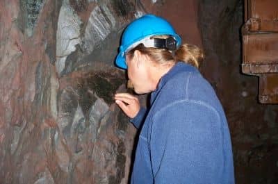My husband touches hematite that is 2.7 billion years old, older than most of the rock in Grand Canyon.