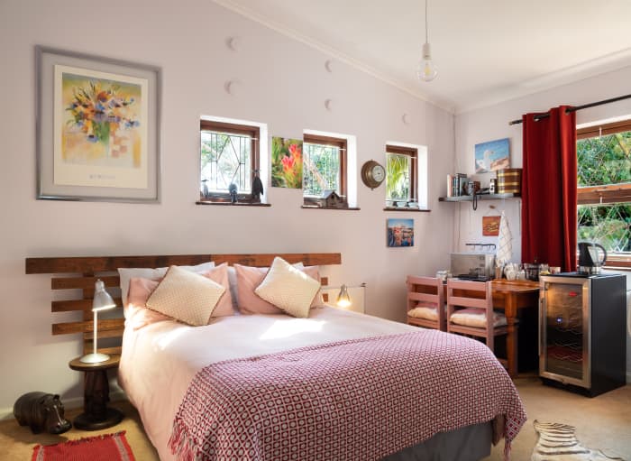 A bedroom is where you want to relax, and red might be too strong of a color. Opt for a more pinkish color. Red curtains might be all you need to get the right vibe.