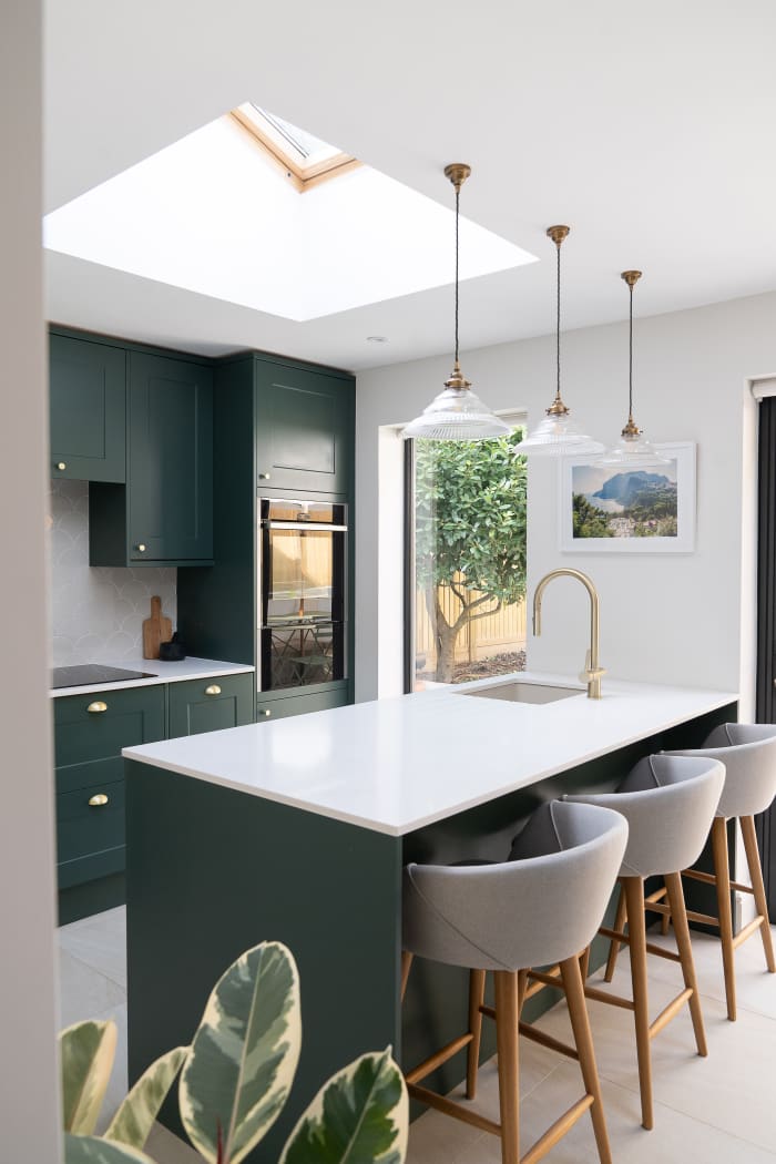 The Taurus kitchen will look lovely in an evergreen shade. Rounded chairs and rounded light fixtures go with Taurus' yin energy. When in doubt, add a houseplant.