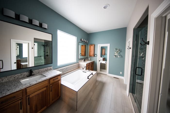 I think a Taurus would be happy with a spacious bathroom with plenty of cabinets and storage space. I'm really digging this shade of green for interior design, particularly for a Taurus template. I also love the unique design of the bathtub.