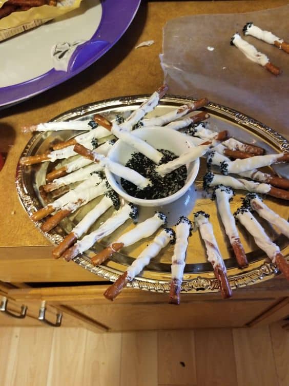 Sweet cigarette snacks are pretzel rods covered with sweet white chocolate and they are completely edible.
