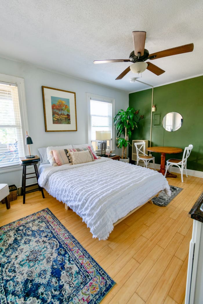 To add color without overwhelming the bedroom with too much energy, opt for an accent wall. White is associated with yang, and it looks good in a room with a Gemini. I love the contrasting patterns and colors in this room.