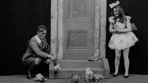 Madge Poole and Will Hay performing a sketch in variety show ' Listening In' at the London's Apollo Theatre in 1922.