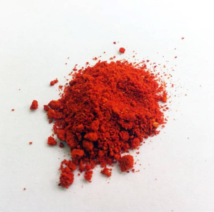 Vermilion pigment was used for rouge and lip paint in Elizabethan times. It contrasted with the white lead.