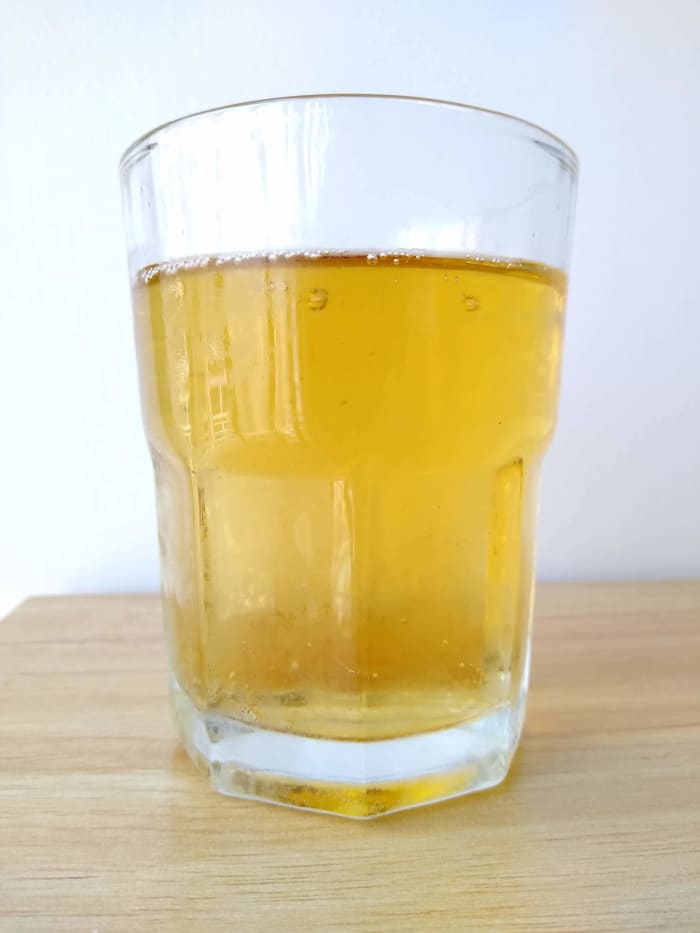 Apple cider vinegar is primarily apple juice, but the addition of yeast converts the juice's sugar into alcohol. This is considered fermentation. Bacteria convert alcohol to acetic acid. That is what gives vinegar its sour flavor and strong odor.