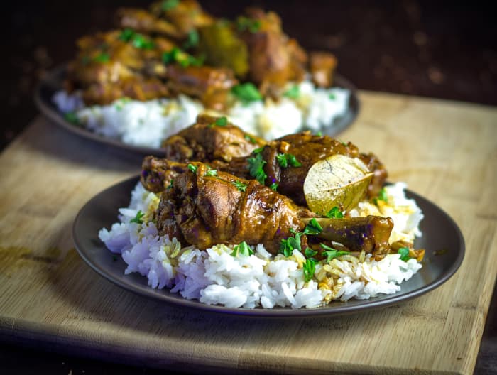 Adobo is made with pantry staples such as white vinegar, soy sauce, garlic, peppercorns, and bay leaves to make a marinade.