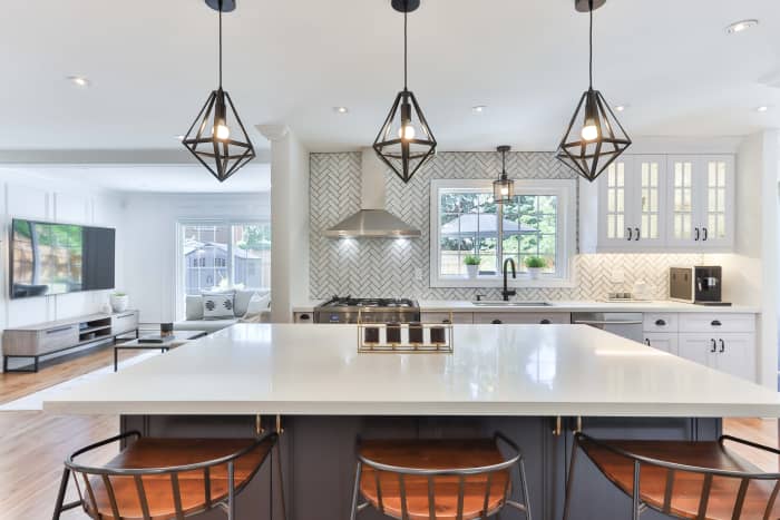 The light fixtures have an elegance about them that reminds me of Cancer. The kitchen has summer vibes with all the natural light that is coming in. The wall designs give the kitchen the right amount of edge.