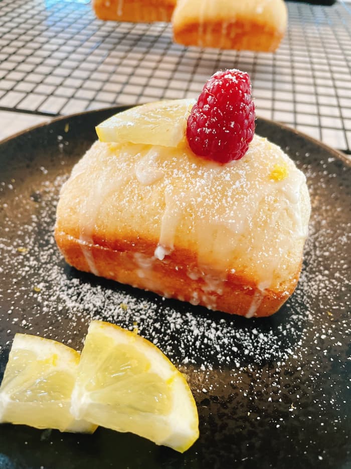 Decadent and moist mini lemon loaf with lemon curd filling. Serve with a glass of iced tea or iced coffee in the summertime. Delish!