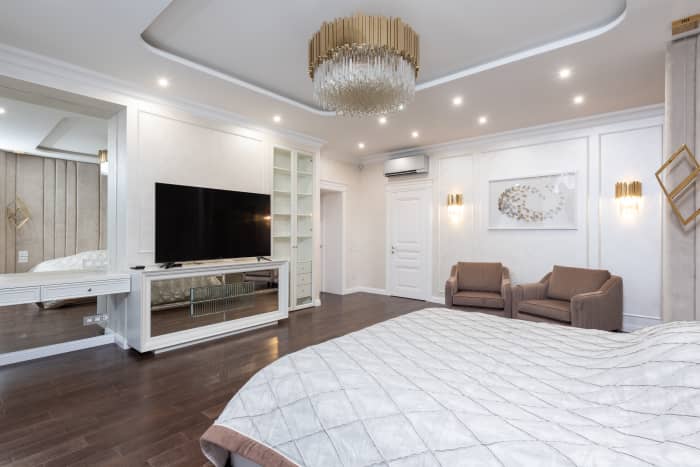 Leo's bedroom is meant to impress. White is a great color in the bedroom because it's a bright color but still calming. Gold fixtures are always on par for the lion, as well as tasteful sitting nooks, elegant shelves, and ornate lights.
