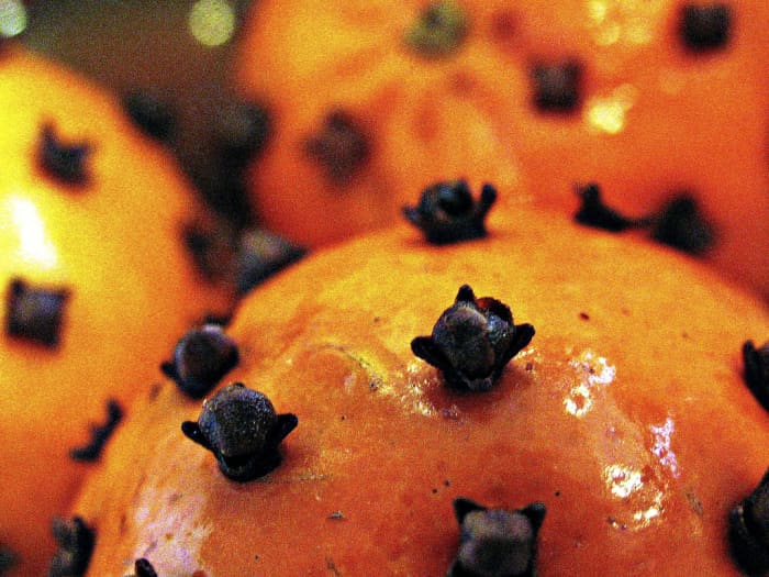 Cloves are sometimes pushed into oranges to create pommanders.