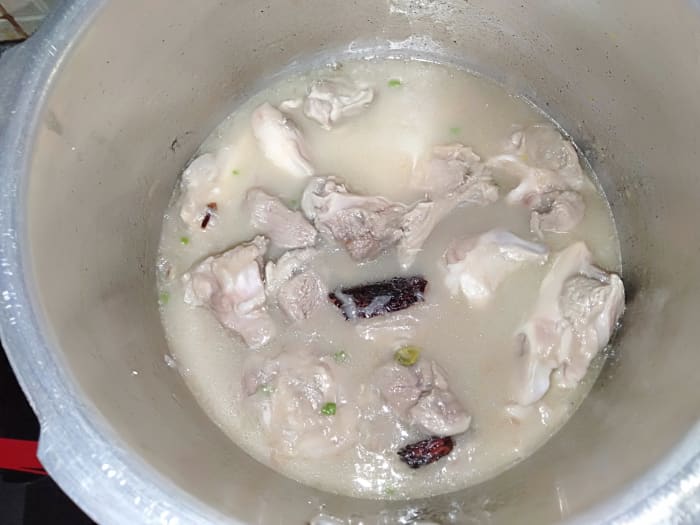 Add ½ cup water and cover it with the lid. Pressure-cook on high flame until one whistle. Cook on low flame for 15 to 20 minutes or until mutton is tender.