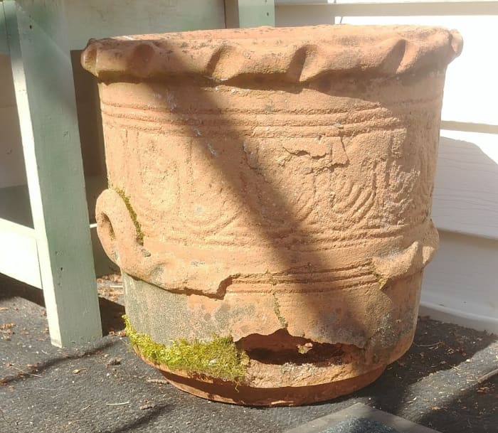 Still usable as is, but will still shine as a garden focal point if and when it is further damaged. Currently holds a plastic pot full of Purple Coneflowers & volunteer Forget Me Nots.
